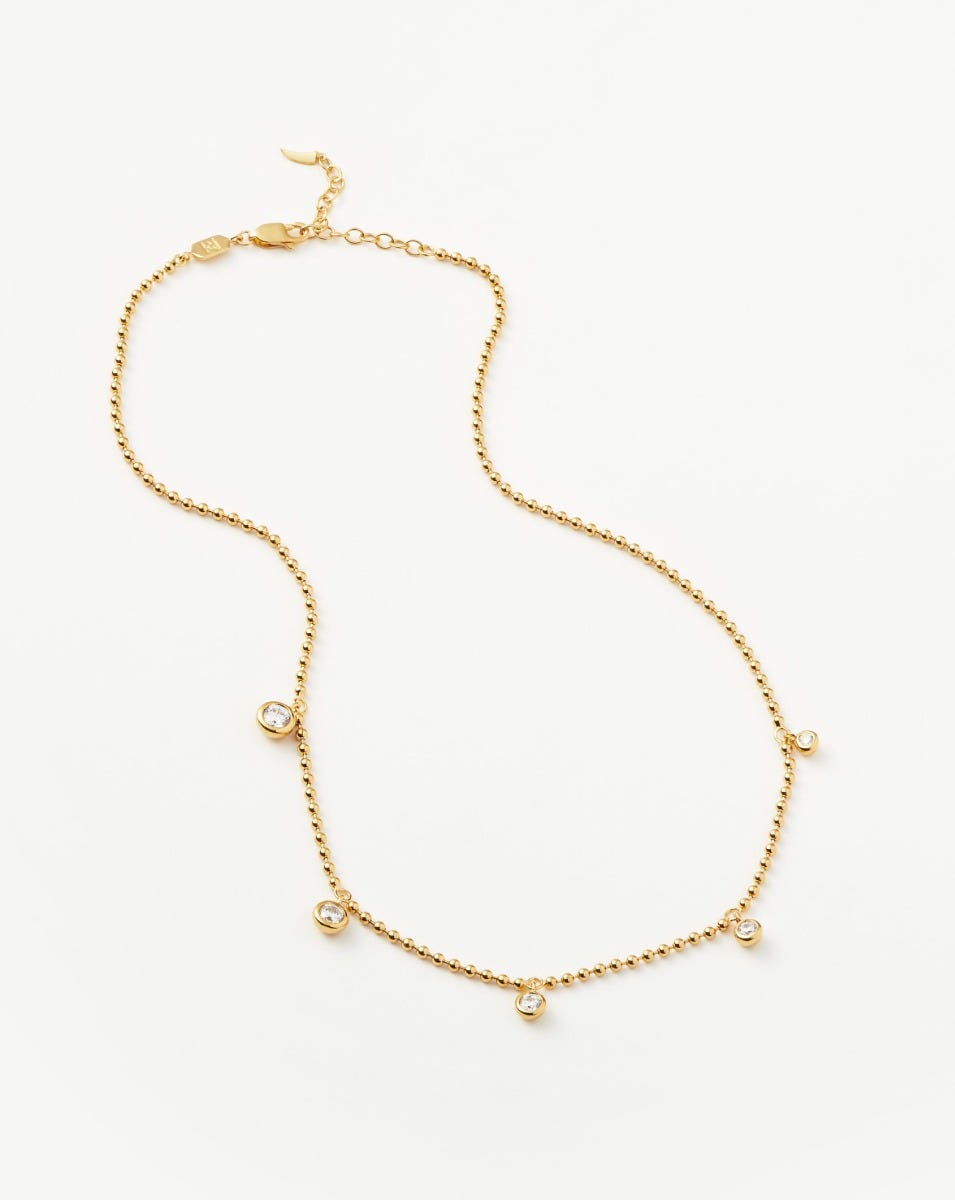 Gold interstellar drop choker top